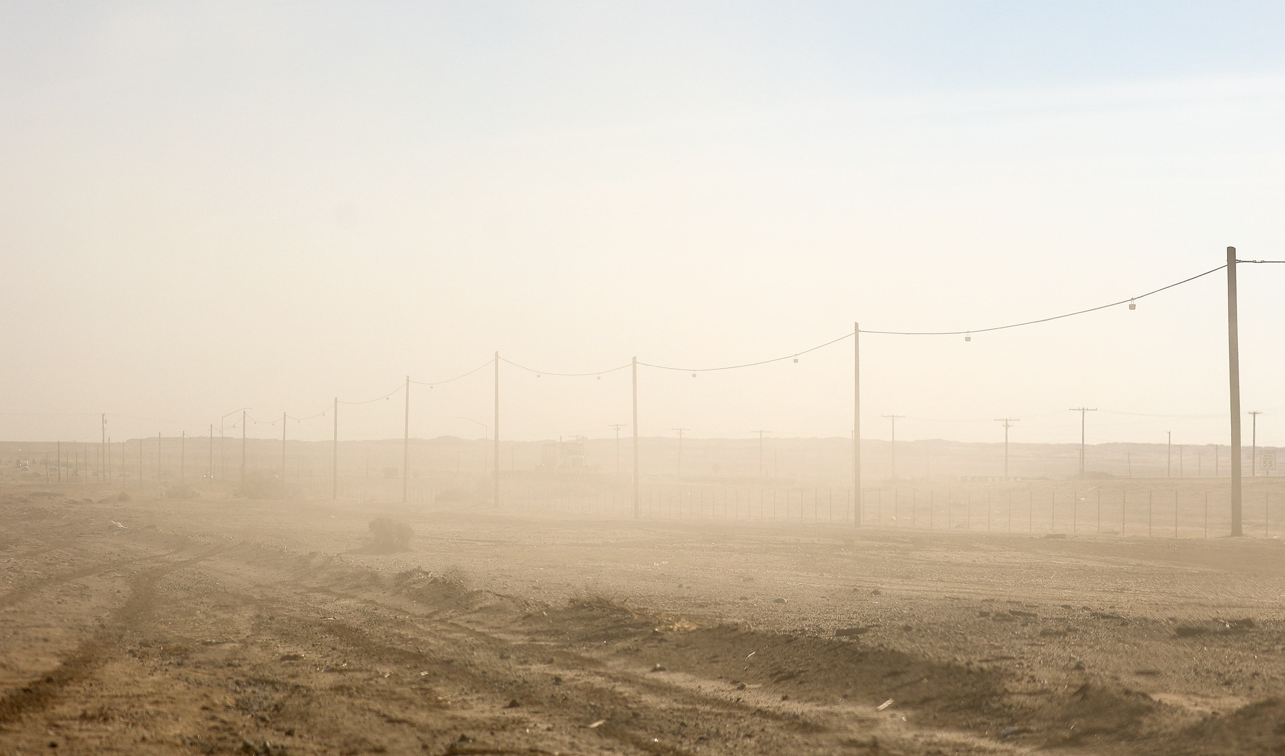 Dust lingers after OHVs drove by in West Shores, Calif., on Friday, Dec. 15, 2023.