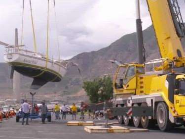 A giant crane lifted larger boats back into their slips at the Great Salt Lake marina Tuesday, a fantastic sign that water levels continue to look promising. (Photo courtesy FOX 13 News).