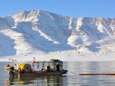 Great Salt Lake Artemia harvester watercraft harvesting brine shrimp eggs during winter harvest season. Courtesy Great Salt Lake Artemia.