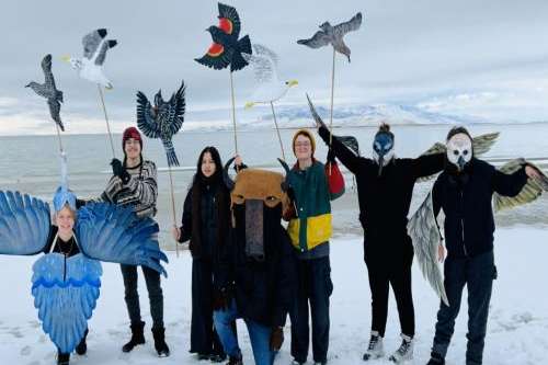 (Lisa Mountain) YCGSL members India Elliott, Braxton Kozerski, Marley Boonkham, Liam Mountain LaMalfa, Adam Newton and Carolee Lewis pose in costumes representing Great Salt Lake’s different species in front of the lake.
