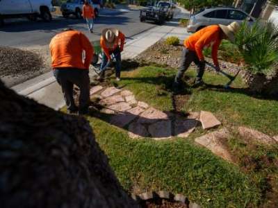 (Trent Nelson | The Salt Lake Tribune) Workers with Foxtail Turf remove the grass from Patricia Council's North Las Vegas yard, replacing it with artificial turf on Thursday, Sept. 29, 2022.